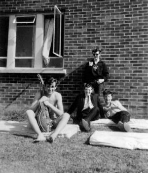 Norman Butcher, with guitar and friends