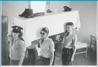 Bored apprentices messing about with a mock coffin